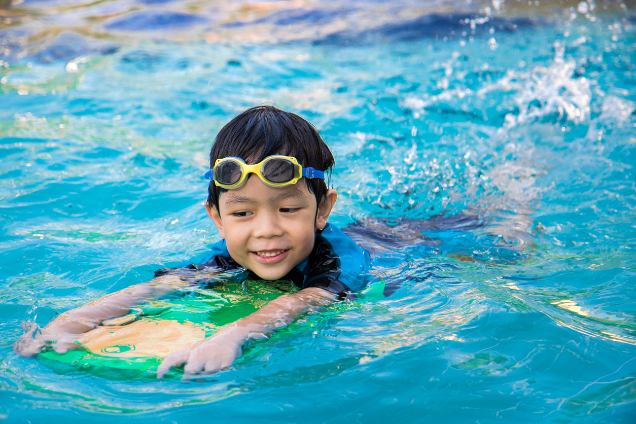 child learning to swim